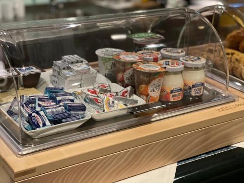 a display case with a bunch of food and drinks at Penzion u Vlčků in Cheb