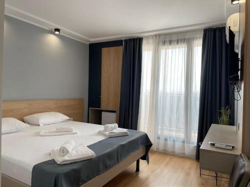 Postel nebo postele na pokoji v ubytování Hotel Unirea