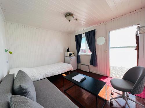 a living room with a couch and a table at Camp Alta Kiruna in Kiruna