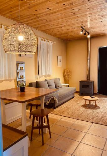 a living room with a couch and a table at Douro Senses - Village House in Cinfães