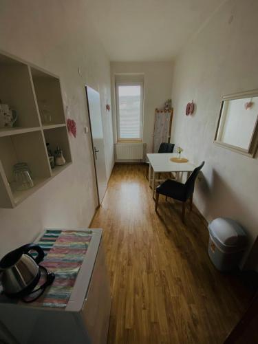 a living room with a table and a dining room at Ubytování Stará in Ústí nad Labem