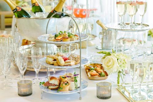 a table topped with plates of food and wine glasses at Sligo Park Hotel & Leisure Club in Sligo