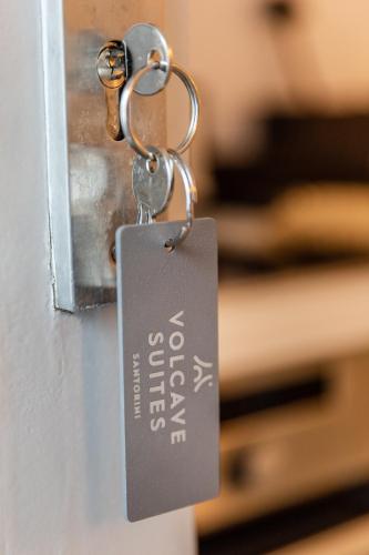 Postel nebo postele na pokoji v ubytování Volcave Suites