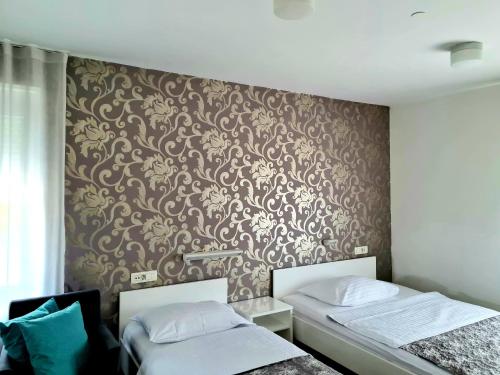 Voodi või voodid majutusasutuse AZUR ROOMS LJUBLJANA toas