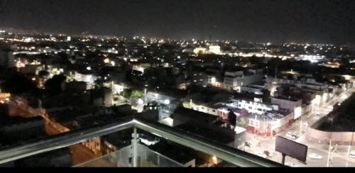 a view of a city at night with lights at YLLARICH in Trujillo