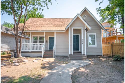 a house with a porch and a fence at Fabulous Newly Renovated 1Br1Ba Near Downtown in San Antonio