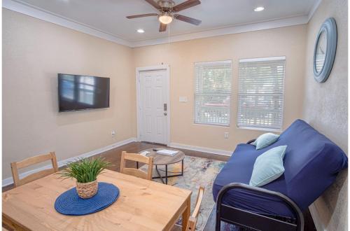 a living room with a blue couch and a table at Fabulous Newly Renovated 1Br1Ba Near Downtown in San Antonio