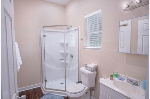 a bathroom with a shower and a toilet and a sink at Fabulous Newly Renovated 1Br1Ba Near Downtown in San Antonio