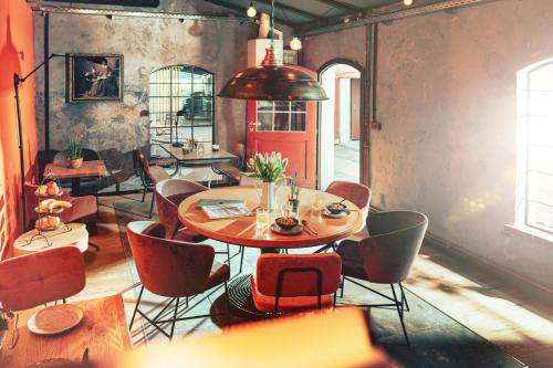 a dining room with a table and chairs at Agli Hotel in Norden