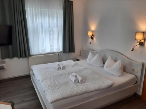 Cama o camas de una habitación en Gasthaus Brockenhėxe mit Restaurant & Café