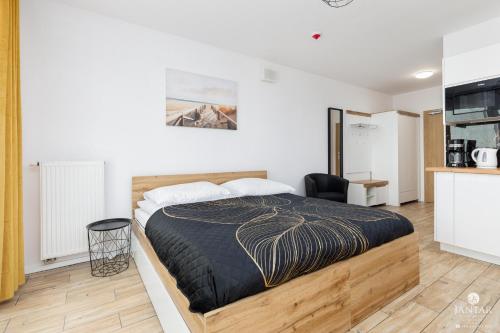 Posteľ alebo postele v izbe v ubytovaní Kasprowicza 20 Uzdrowisko by Jantar Apartamenty Kołobrzeg
