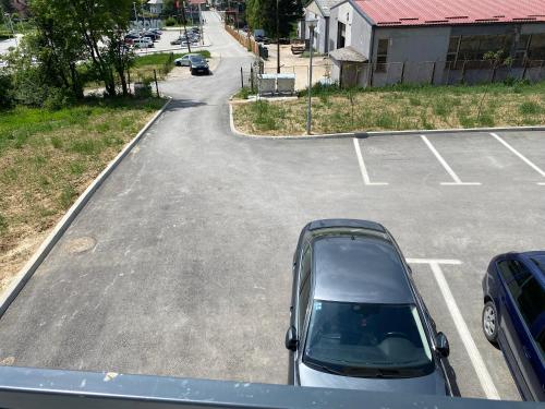 a car parked in a parking lot at New Apartment in the City in Visoko