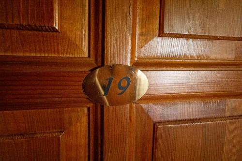 a door knob with the number on it at Radics Panzió Étterem és Pihenő Központ in Letenye