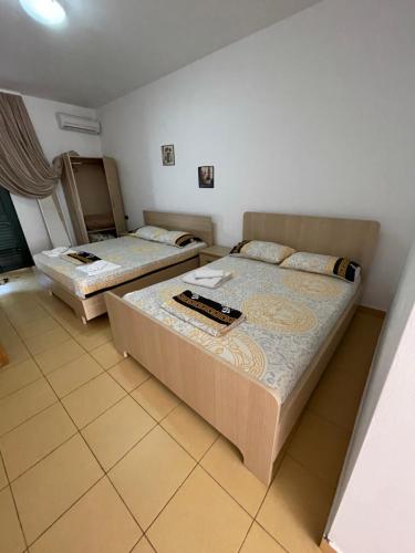 Lova arba lovos apgyvendinimo įstaigoje Hotel villa Petro Dhërmi