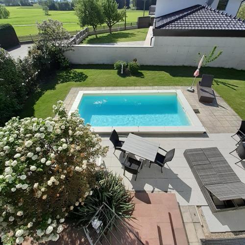 an overhead view of a swimming pool in a yard at Reitbergs Nest in Eugendorf