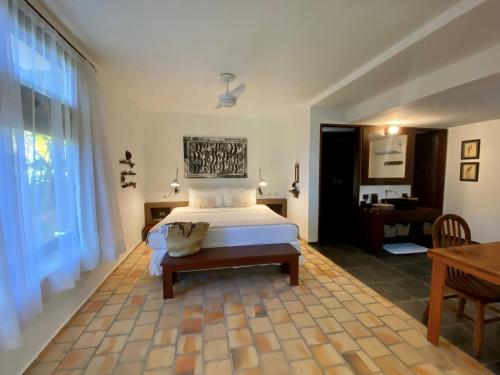 Ένα ή περισσότερα κρεβάτια σε δωμάτιο στο Kilombo Villas & Spa