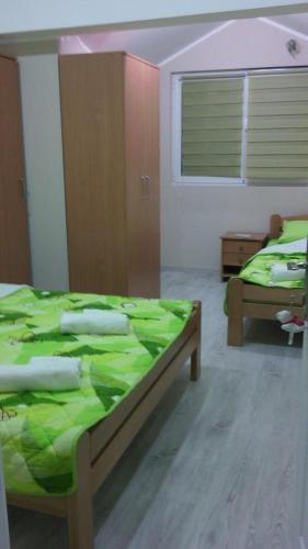 Ένα ή περισσότερα κρεβάτια σε δωμάτιο στο Guest House Konak Iris