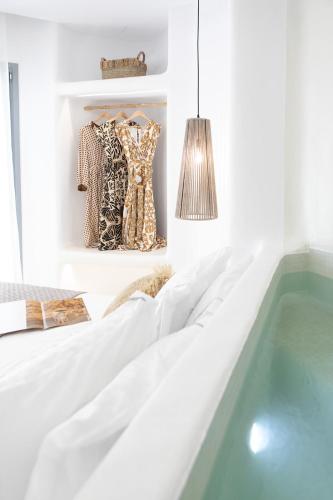 a bathroom with a bathtub and a tub at Majestique of Naxos in Naxos Chora