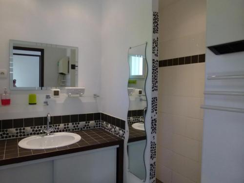 a bathroom with a sink and a mirror at Maison neuve à Jard-sur-Mer, proche plage, forêt, port, 4 pers, WiFi, jardin, plancha - FR-1-336-59 in Jard-sur-Mer