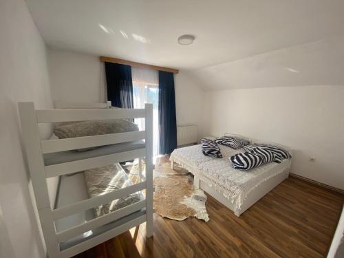 Ένα ή περισσότερα κρεβάτια σε δωμάτιο στο Vila Una 1