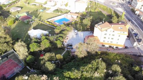an aerial view of a house with a pool at Hotel Cabo Festiñanza in Sanxenxo