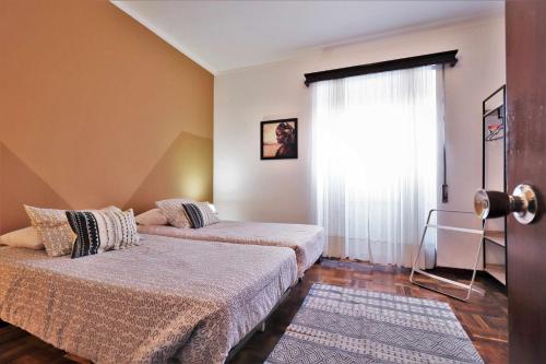 Katil atau katil-katil dalam bilik di Costa Norte Guesthouse