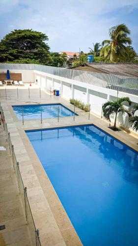 a large swimming pool with blue water at Apartamento Sea View 503B in San Andrés