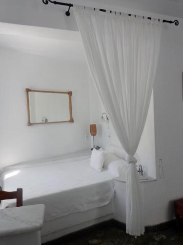 Ένα ή περισσότερα κρεβάτια σε δωμάτιο στο Langas Villas