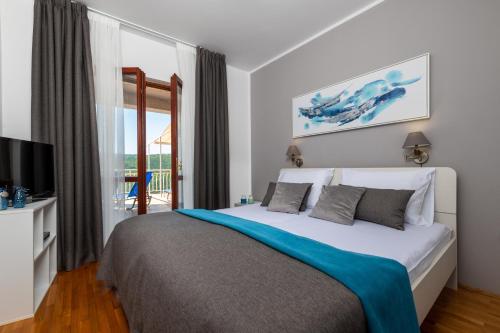 Giường trong phòng chung tại Apartments Valentino