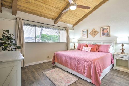 a bedroom with a bed with pink sheets and a window at Chic Waikoloa Condo with Lanai and Complex Pools! in Waikoloa