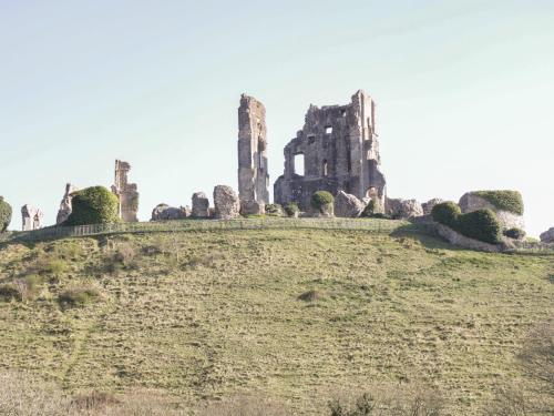an old castle on top of a hill at Bluebell Apartment in Swanage