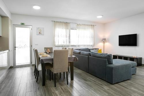 a living room with a couch and a table at Just Sea in Peniche