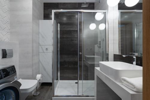 Ένα μπάνιο στο Symphony Modern Tower Apartamenty