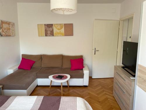 a living room with a couch and a table at Apartment Beauty in Pula