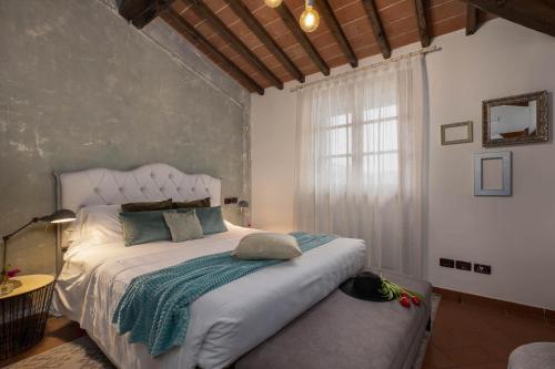 Postel nebo postele na pokoji v ubytování DormiVeglia B&B