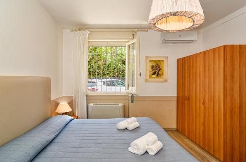 Postel nebo postele na pokoji v ubytování Hotel Ambra