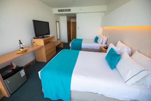 Televisyen dan/atau pusat hiburan di Hotel Enjoy San Antonio