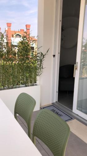 a table and two chairs sitting on a balcony at Maribeach in Cavallino-Treporti
