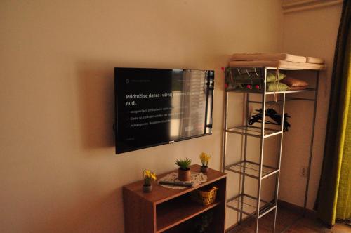 a flat screen tv hanging on a wall at Guest House Stefica in Hvar
