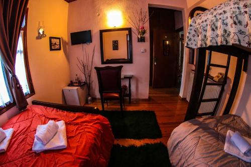 a bedroom with a bed and a bunk bed at Mylos in Arkochórion