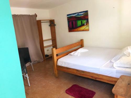 a bedroom with two beds in a room at Sunshine Hotel Little Corn Island in Little Corn Island