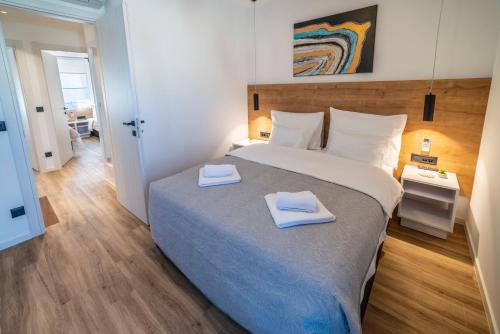 Posteľ alebo postele v izbe v ubytovaní PINNA RESIDENCE - Supin