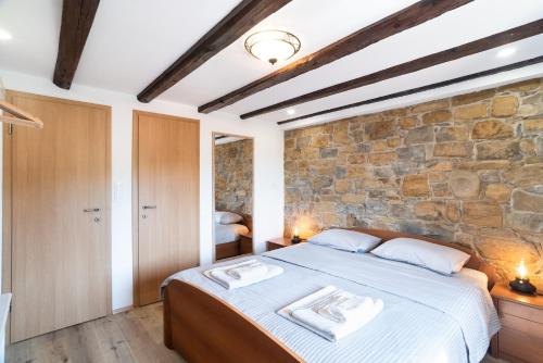 Ένα ή περισσότερα κρεβάτια σε δωμάτιο στο Boutique House Rustikana by Locap Group