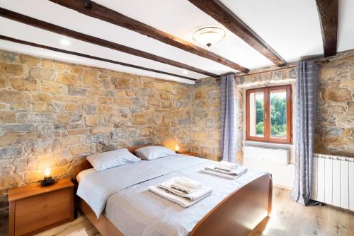 Ένα ή περισσότερα κρεβάτια σε δωμάτιο στο Boutique House Rustikana by Locap Group