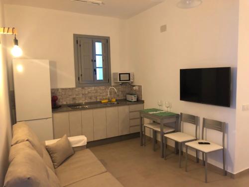 Televizors / izklaižu centrs naktsmītnē Apartamentos Casa la Costanilla