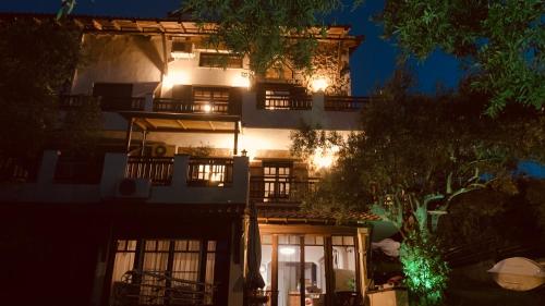 a lit up building at night with lights at Thea Thalassa in Vourvourou
