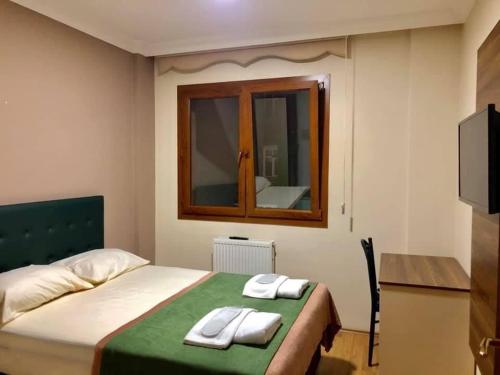 Postel nebo postele na pokoji v ubytování Trabzon Akgüller Apart
