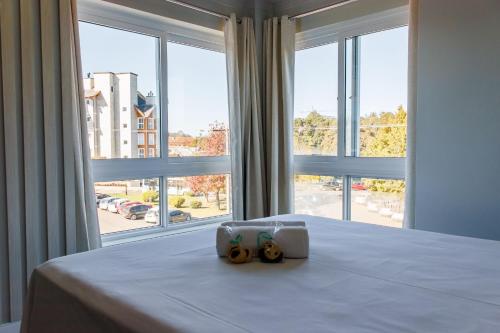 Postel nebo postele na pokoji v ubytování Locar-in Canela - Apto junto a Rua Coberta Canela