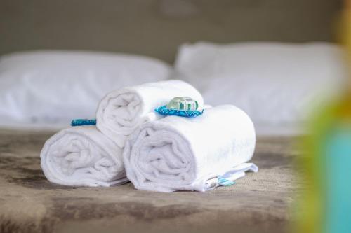 a stack of towels with a ring on top at Paseo Del Molino - 703 in Caxias do Sul