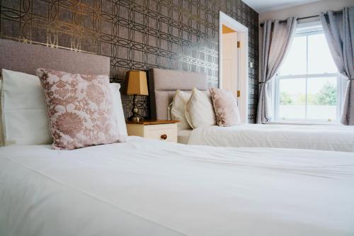 Ένα ή περισσότερα κρεβάτια σε δωμάτιο στο Plougastel House B&B